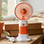 Handheld fan showing USB charging port for convenient recharge