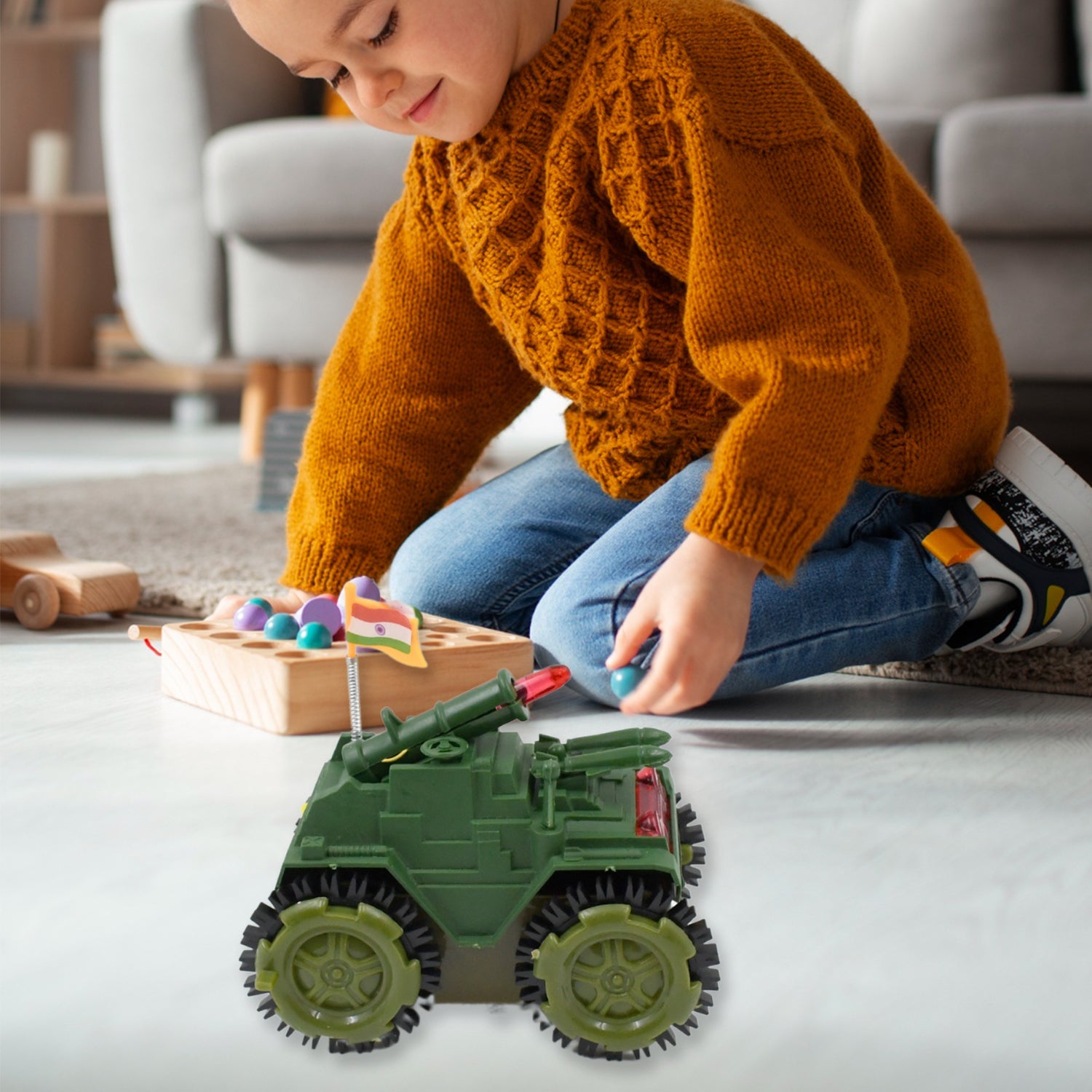 A child happily playing with the Tumbling Tank Toy Car, demonstrating its dynamic movement.