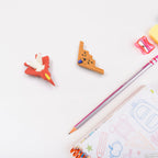 A pack of playful gun and plane shape erasers, great for children's stationery.