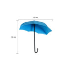 Side view of an umbrella key holder demonstrating its adhesive backing.