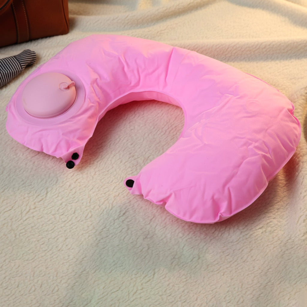 Close-up of manual air valve on inflatable travel neck pillow