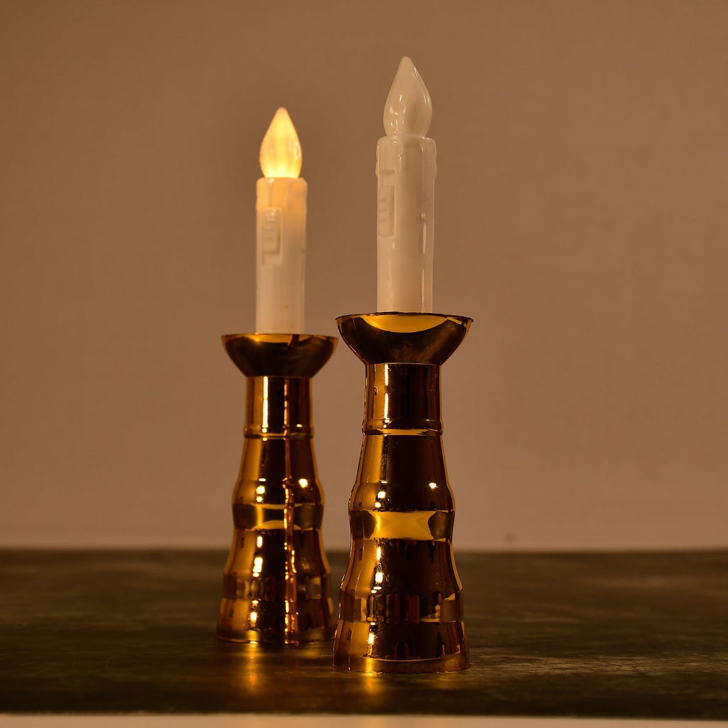 A pair of decorative flameless LED candle lights creating a warm ambiance.