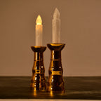 A pair of decorative flameless LED candle lights creating a warm ambiance.