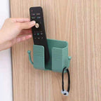 Compact wallmount mobile stand with integrated hook, holding a smartphone and keys.