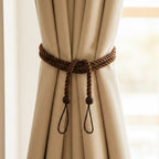 Curtain strap with decorative rope and floral accents for windows