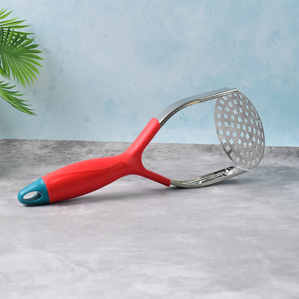 Supermom Food Masher effortlessly mashing potatoes in a bowl.