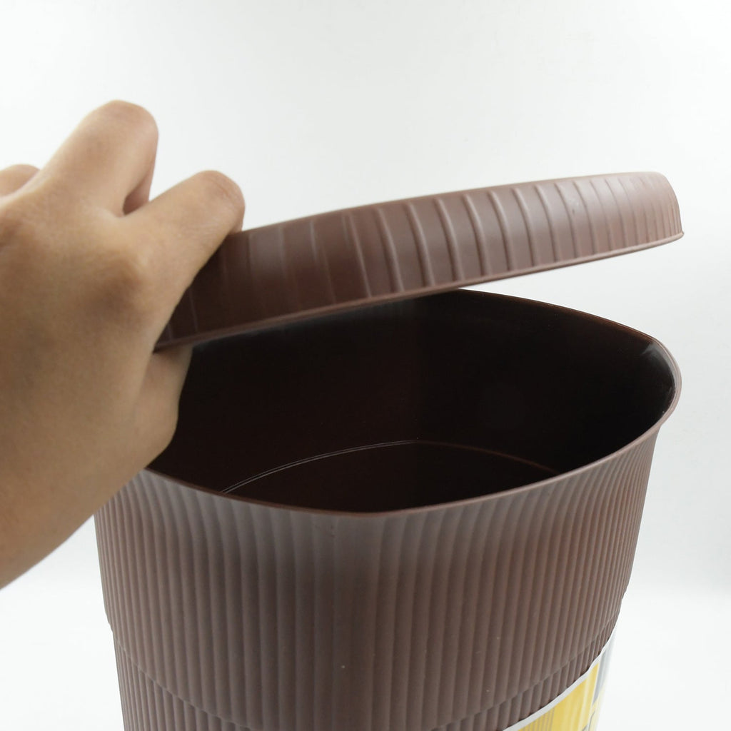 Close-up of the robust pedal mechanism on the mini plastic dustbin.