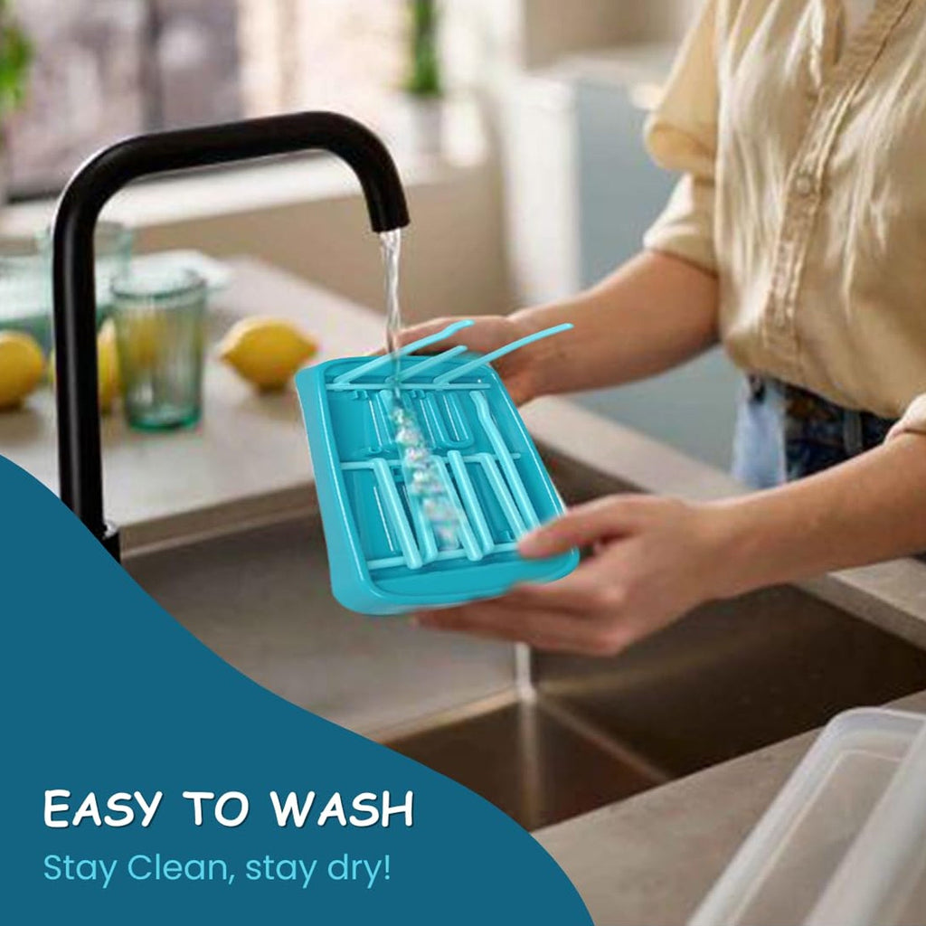 Close up of baby feeding bottle drying rack showing vertical bottle holders