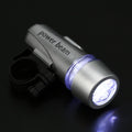 Bright LED bicycle headlight securely mounted on a bike handlebar.