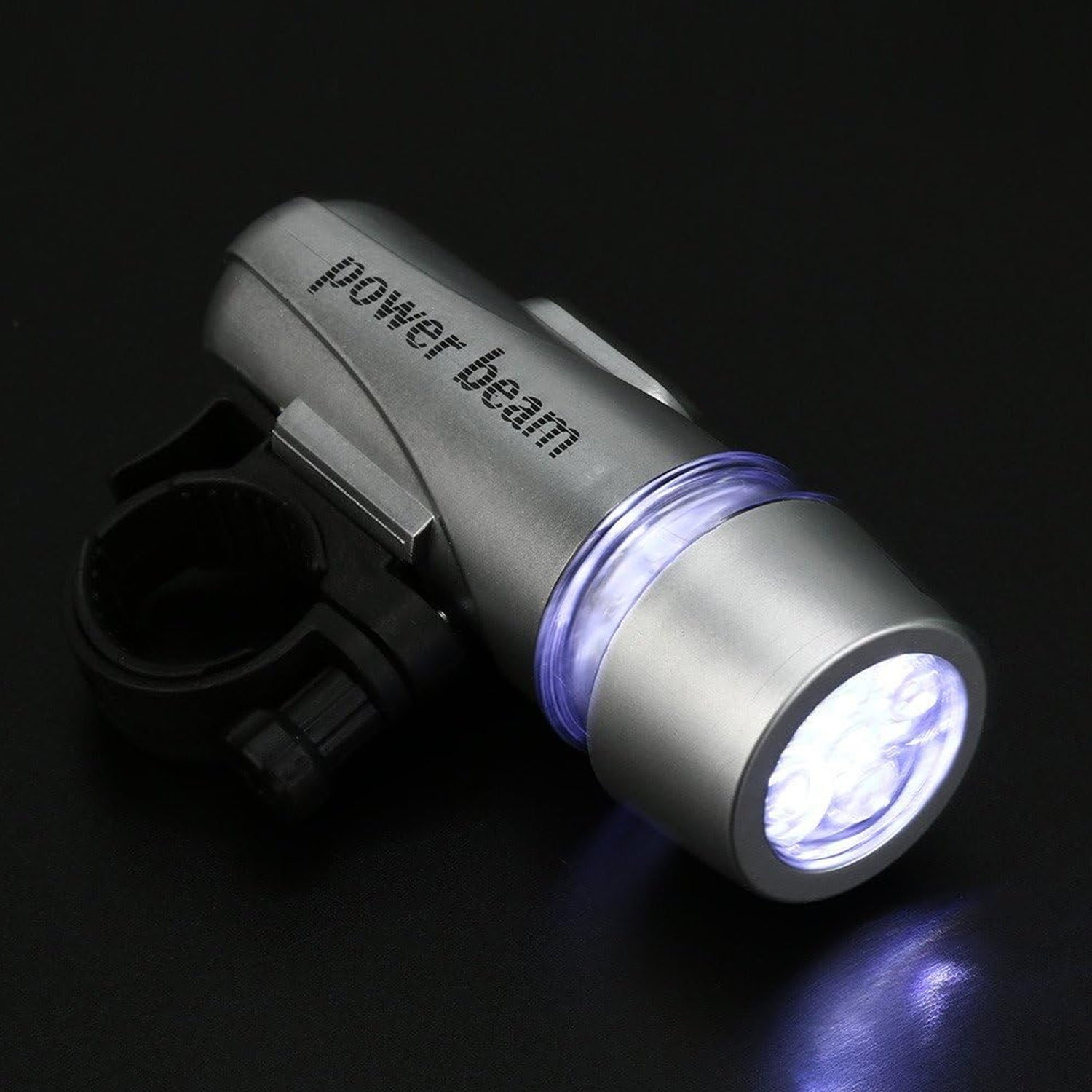 Bright LED bicycle headlight securely mounted on a bike handlebar.