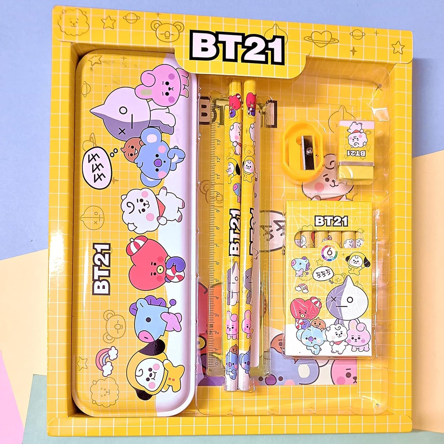 Organized metal pencil box and stationery set for kids with sharpener, pencils, and erasers.