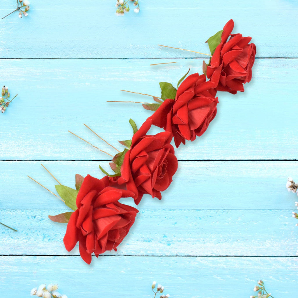 Various red rose bridal hair clips arranged, highlighting their versatile use.