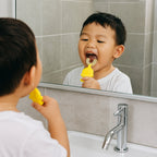 Baby toothbrush featuring easy-grip duck handle for toddlers