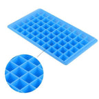 Ice cubes freshly removed from the 60-Cavity Ice Tray, ready for a chilled beverage.