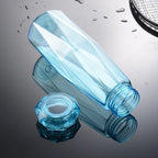 Compact glass water bottle with BPA-free plastic cap for hydration