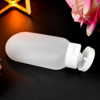 JourneySet of 60ml travel bottles with secure, flip-top caps, ideal for carrying various toiletry liquids.
