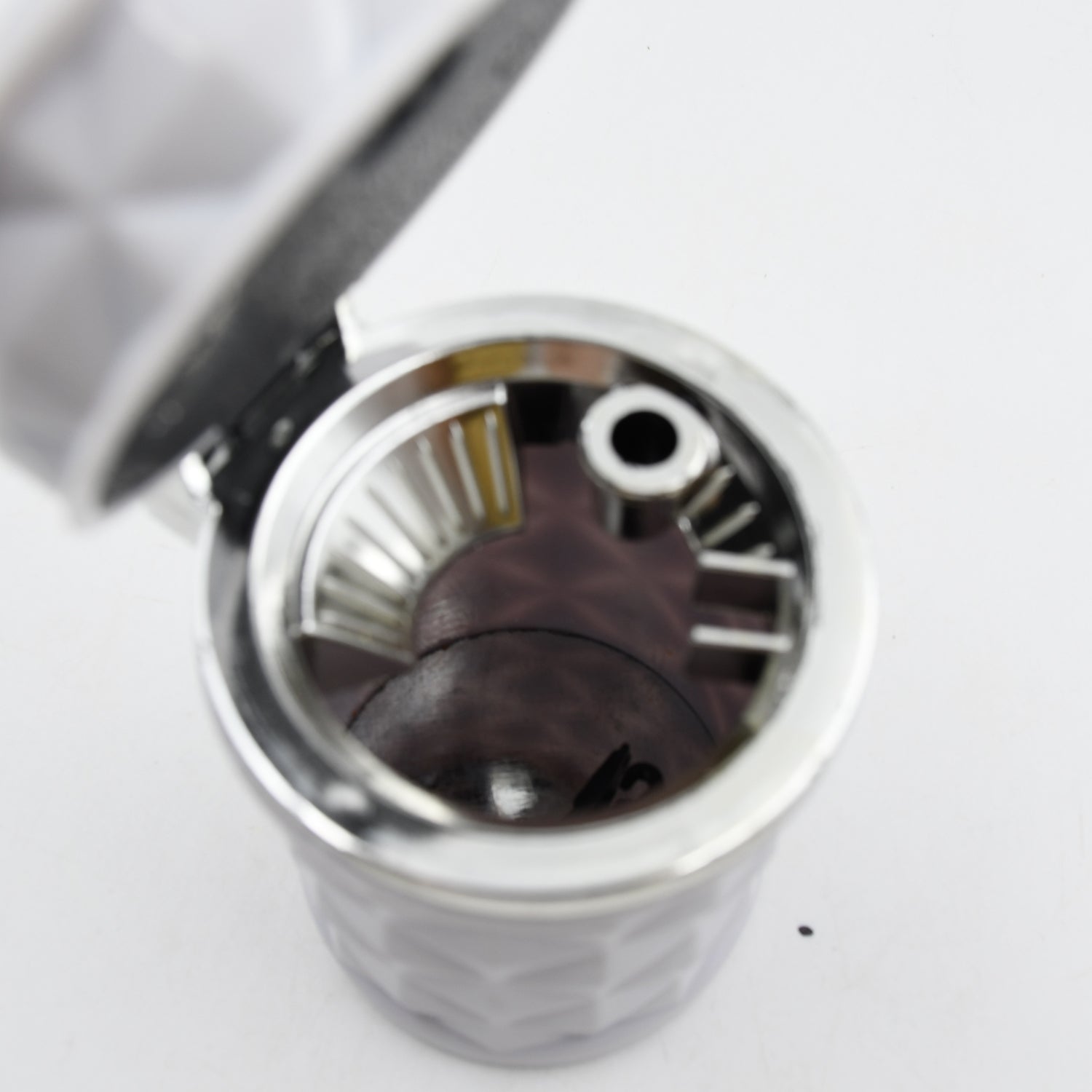 Functional car ashtray with blue LED light, designed for vehicle cup holders.