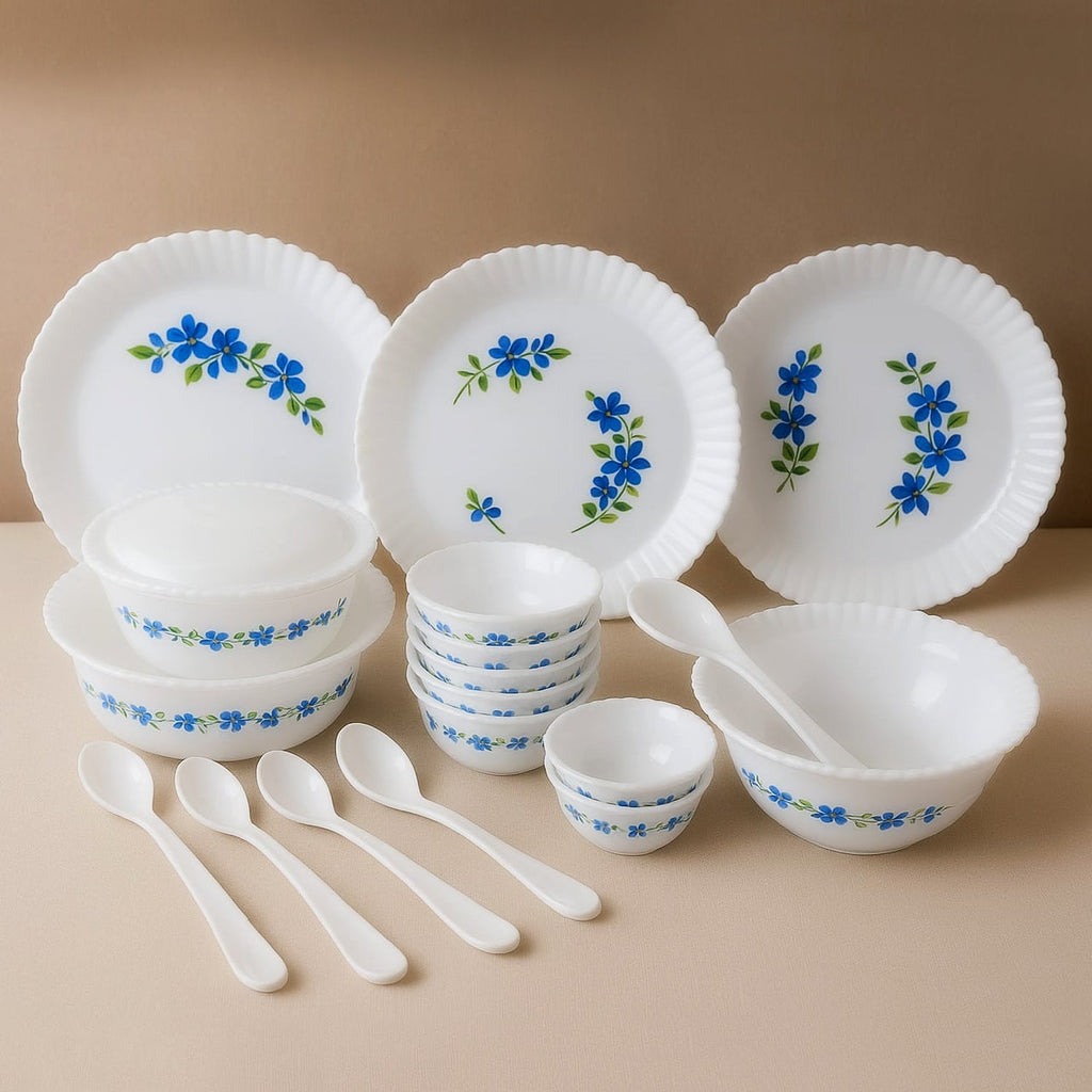 Complete plastic dinner set with blue flower design on white plates