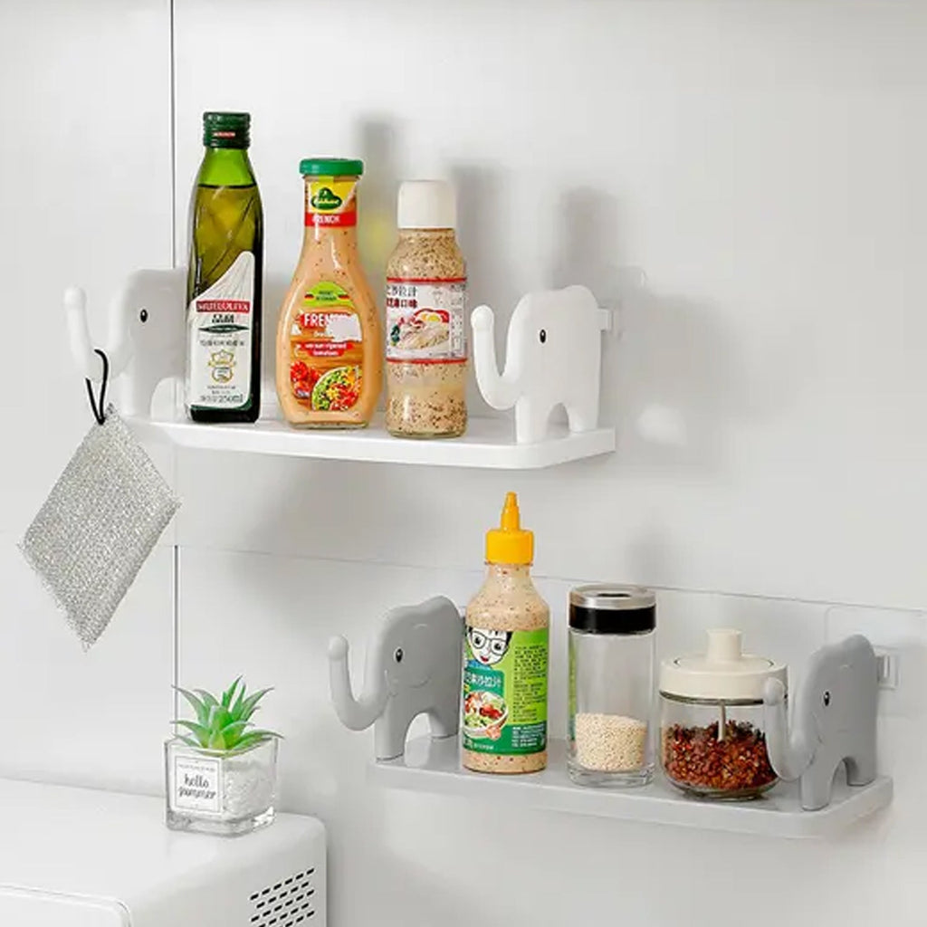 Cute elephant wall shelf used as a storage rack in a study room.