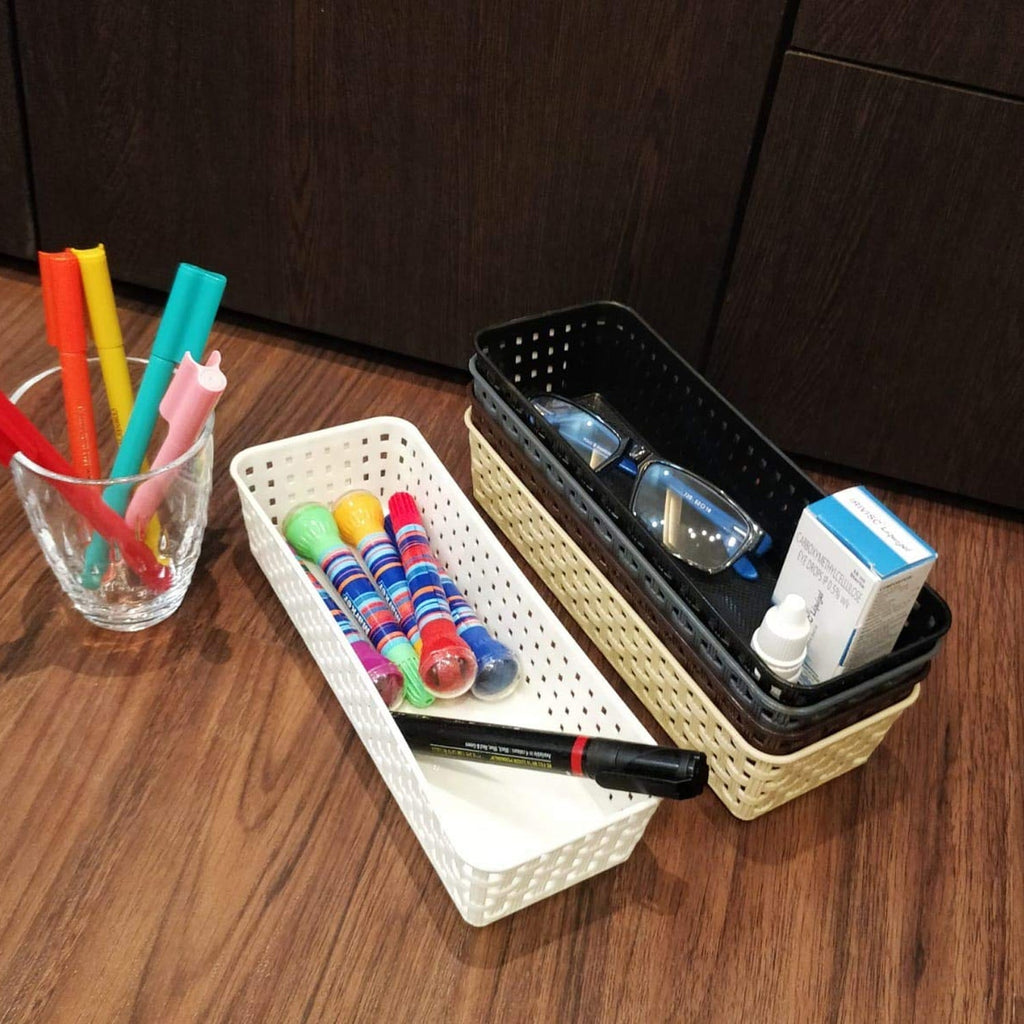 Different sizes of the modular desk organizer trays stacked together.