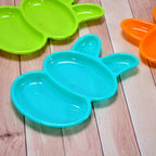 Overhead shot of the charming rabbit dish set for children, in various colours.