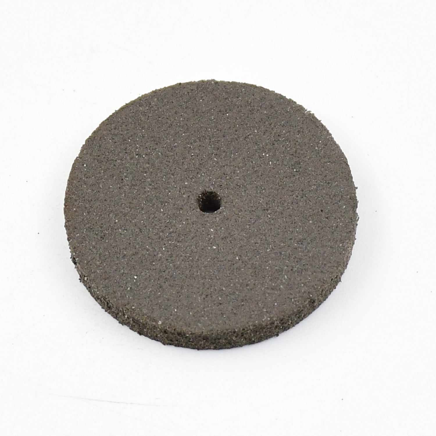 Detailed view of a single durable resin grinder cutting disc for metalwork.