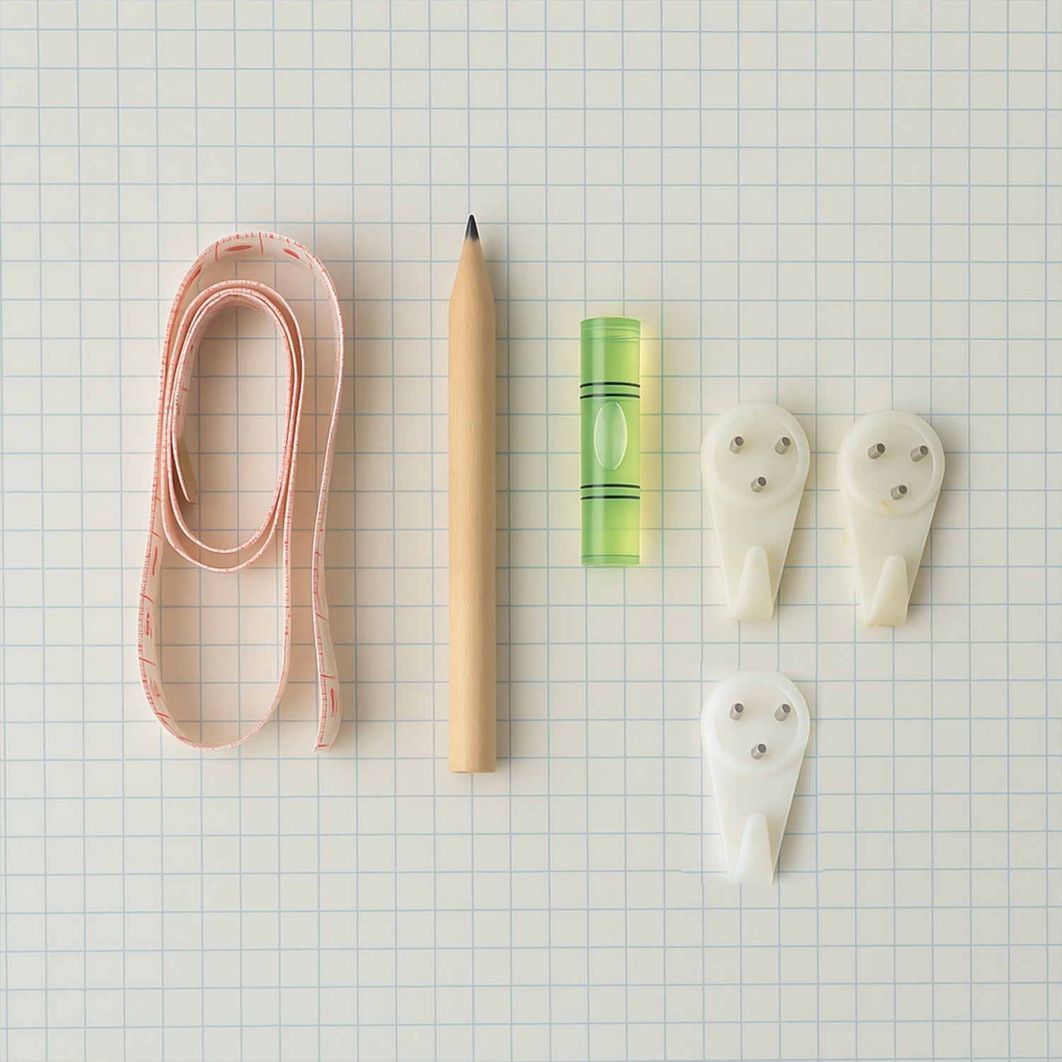 Close-up of wall hanging tools with measuring tape and bubble level