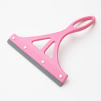 Multipurpose plastic wiper resting on a clean kitchen platform.