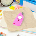 Mini Cloud Cutter utility knife being used to cut a plastic bag smoothly