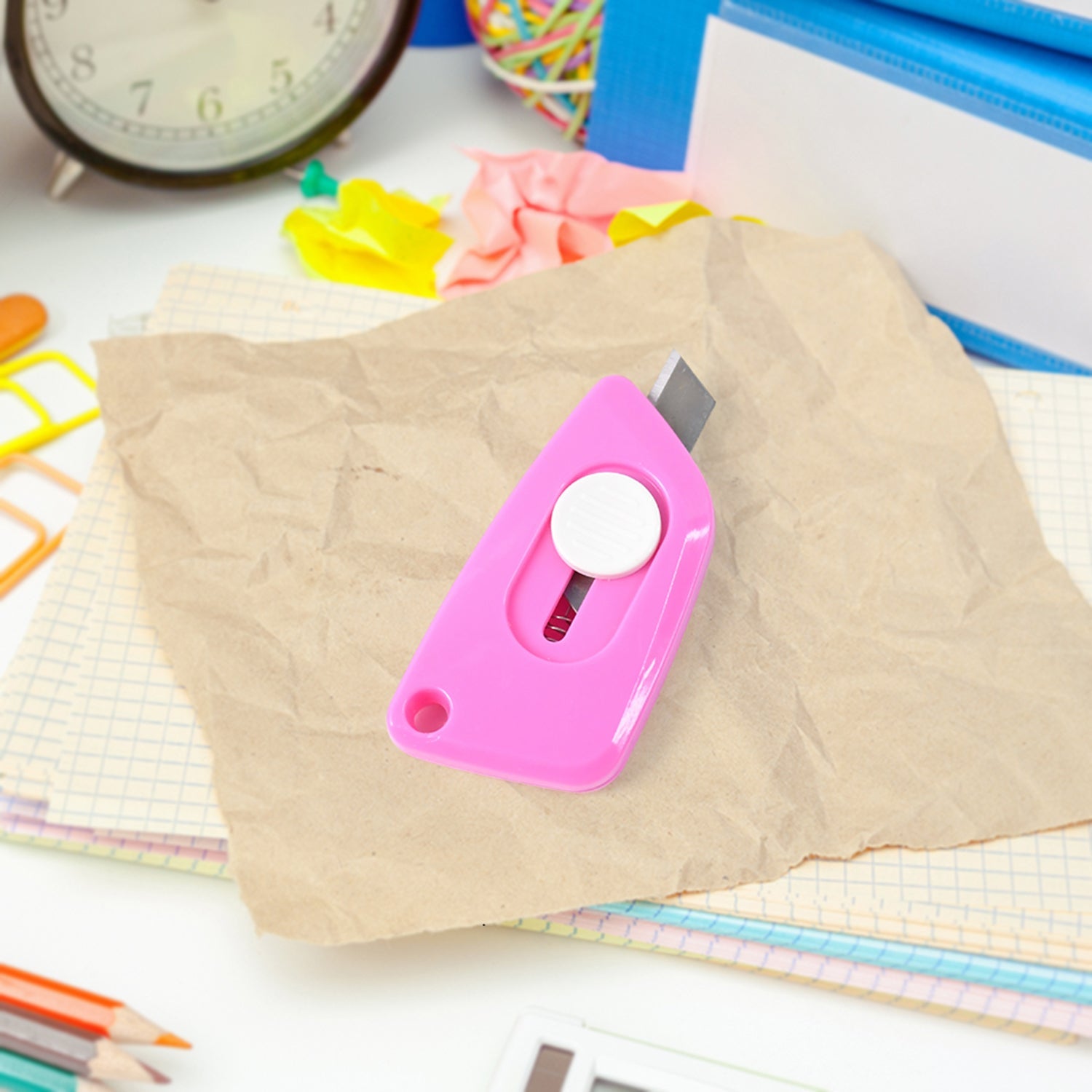 Mini Cloud Cutter utility knife being used to cut a plastic bag smoothly