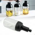 A Heat-Resistant Glass Seasoning Jar with integrated spoon, perfect for kitchen use.