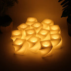 Cluster of flameless LED candles with modern square design and warm glow
