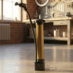 The compact Mini Hand Air Pump displayed alongside various sports balls like a football and basketball.