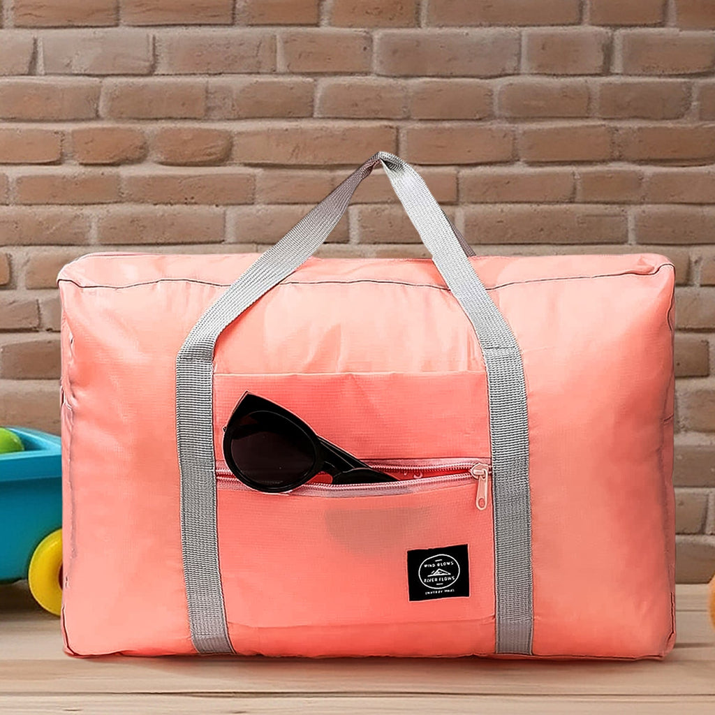Spacious interior of the blue travel bag filled with clothes and travel essentials.