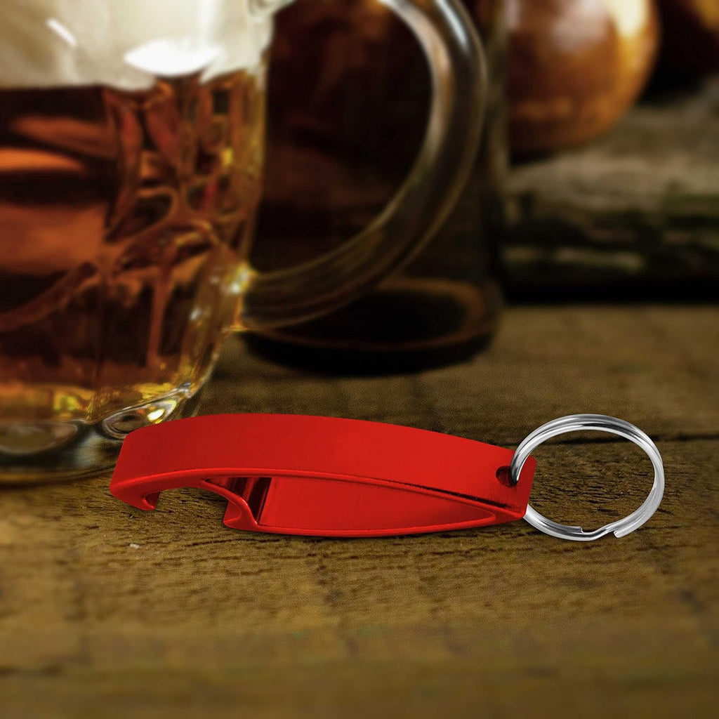 Compact metal bottle opener keychain displayed on flat surface