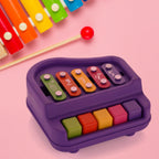 Happy toddler playing with the educational Baby Piano Xylophone toy.