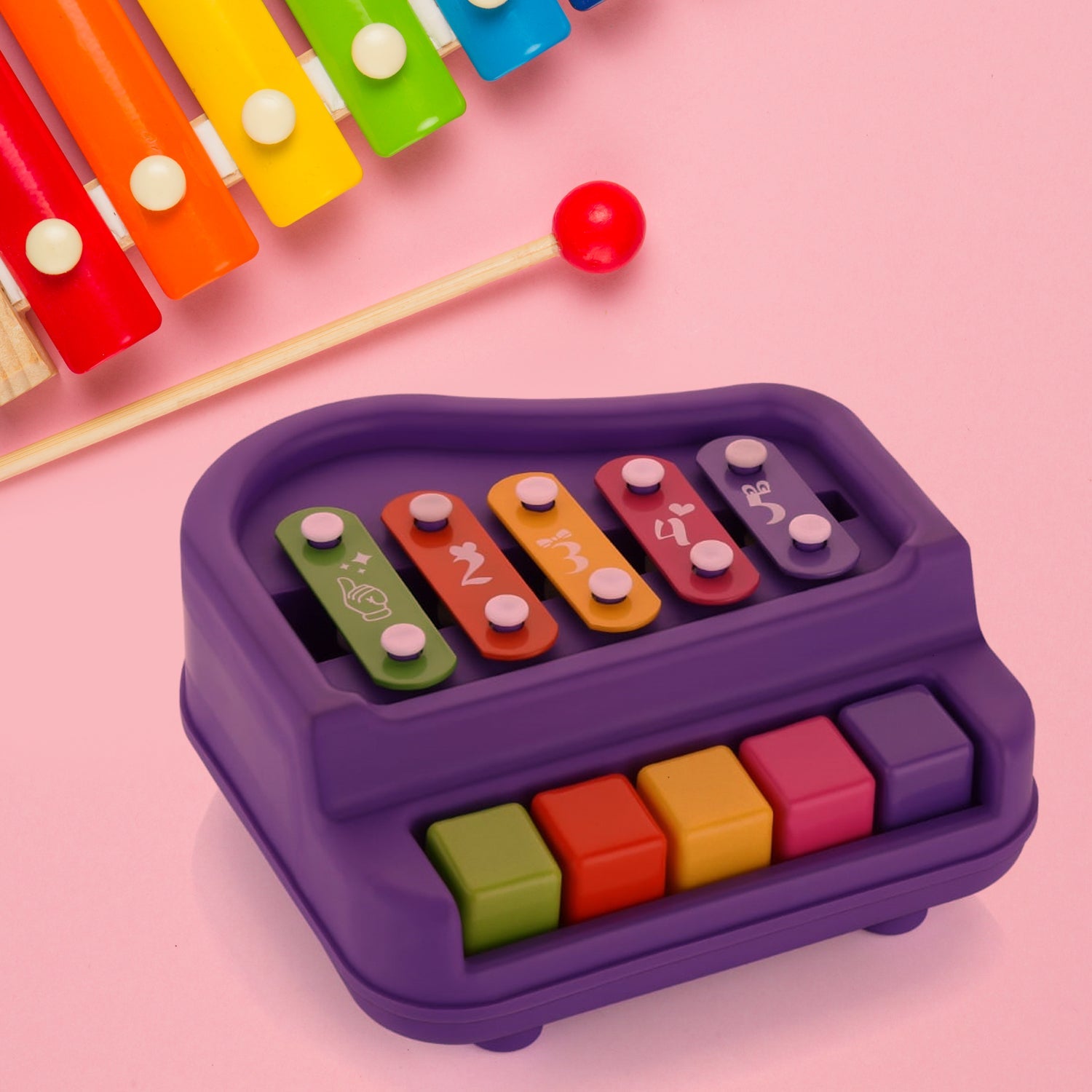 Happy toddler playing with the educational Baby Piano Xylophone toy.