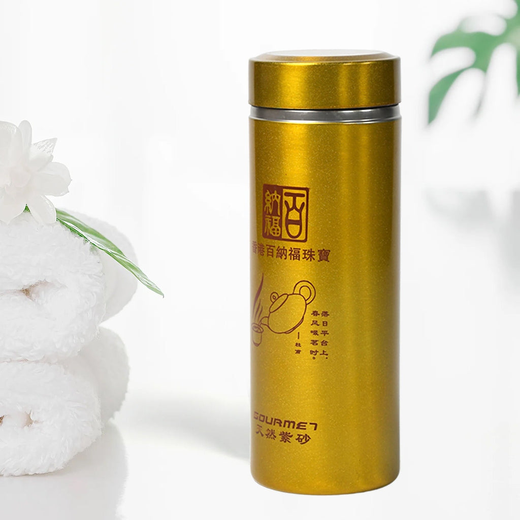 Compact 300ml Vacuum Water Bottle in grey, perfect for daily commutes and travel, shown on a table.