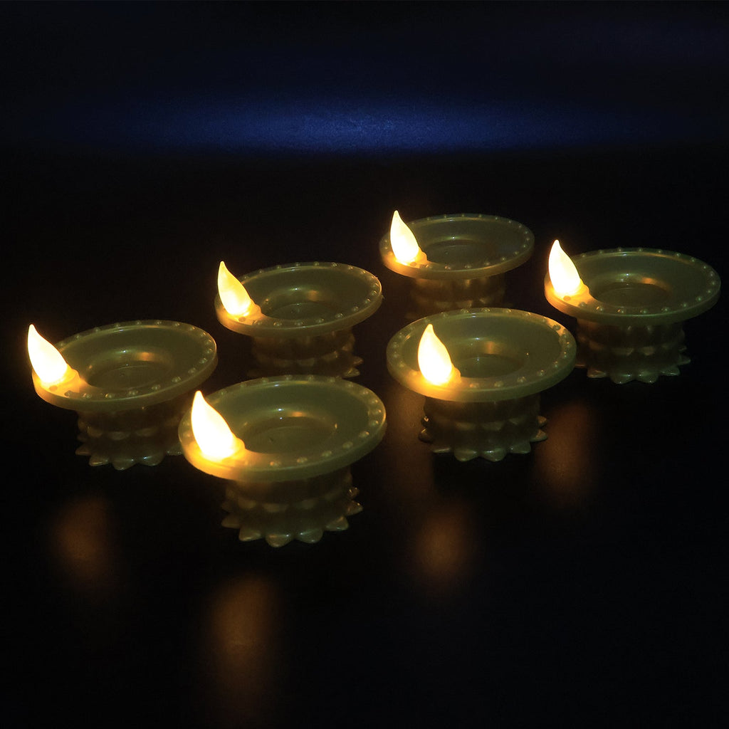 Traditional design water sensor golden LED diyas arranged for festive decoration