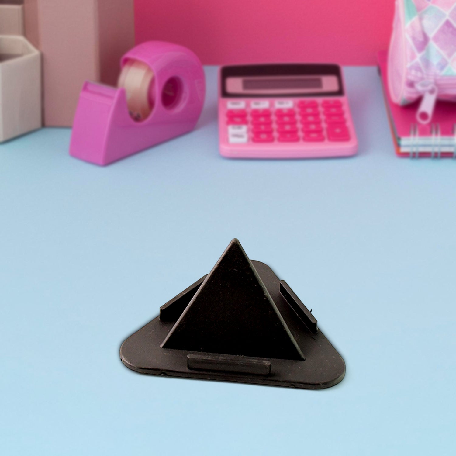 Close-up of pyramid design phone stand supporting a smartphone