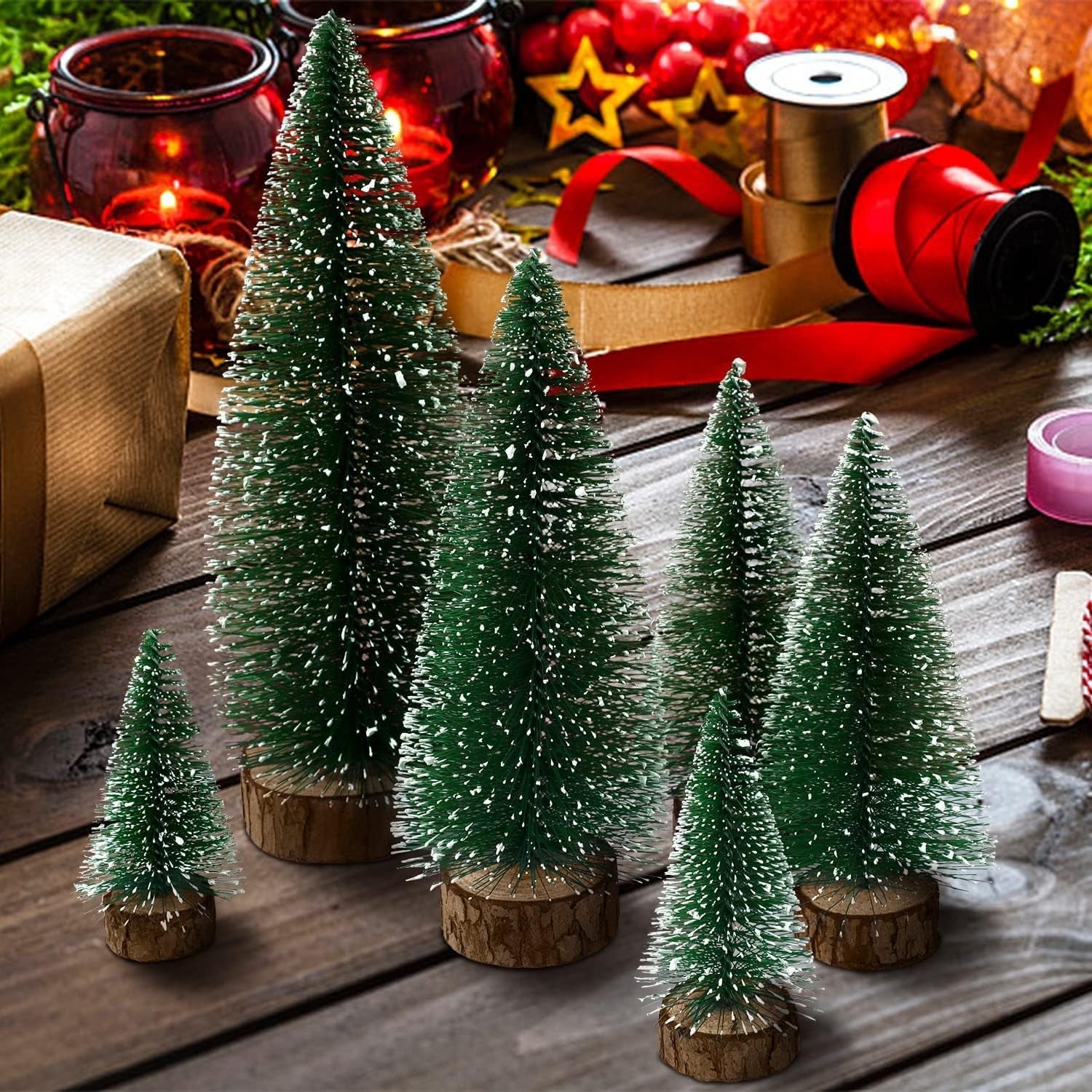 Compact snow effect Christmas tree with sturdy wooden base perfect for holiday decor
