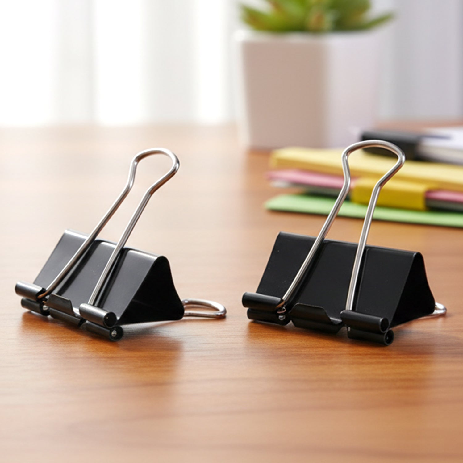 Close-up view of black metal 19mm binder clip showing spring