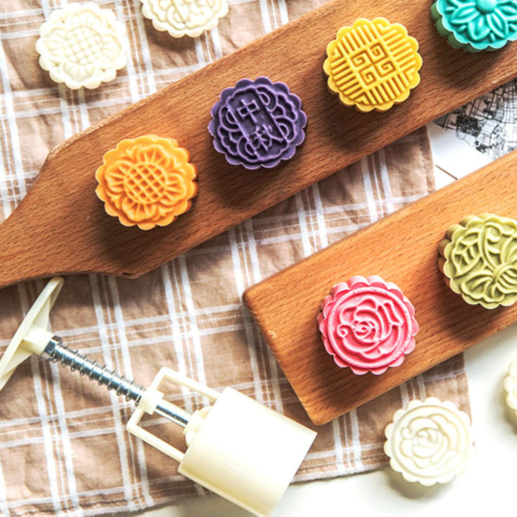 Mooncake Press Mold kit showing 4 interchangeable floral stamps for detailed baking