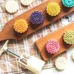 Mooncake Press Mold kit showing 4 interchangeable floral stamps for detailed baking