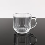 Transparent plastic tea cup filled with hot beverage, lightweight design