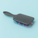 The Scalp Massager Comb displayed cleanly on a neutral white background.