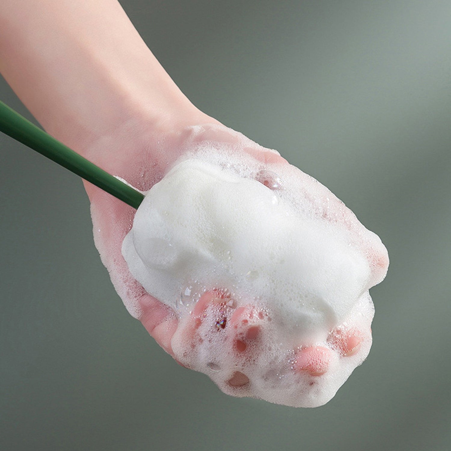 Versatile foam cleaning brush designed for various drinkware, including baby bottles.