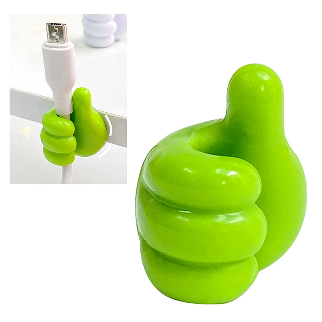 Green hand-shaped wall clip holder mounted on a wall holding cables