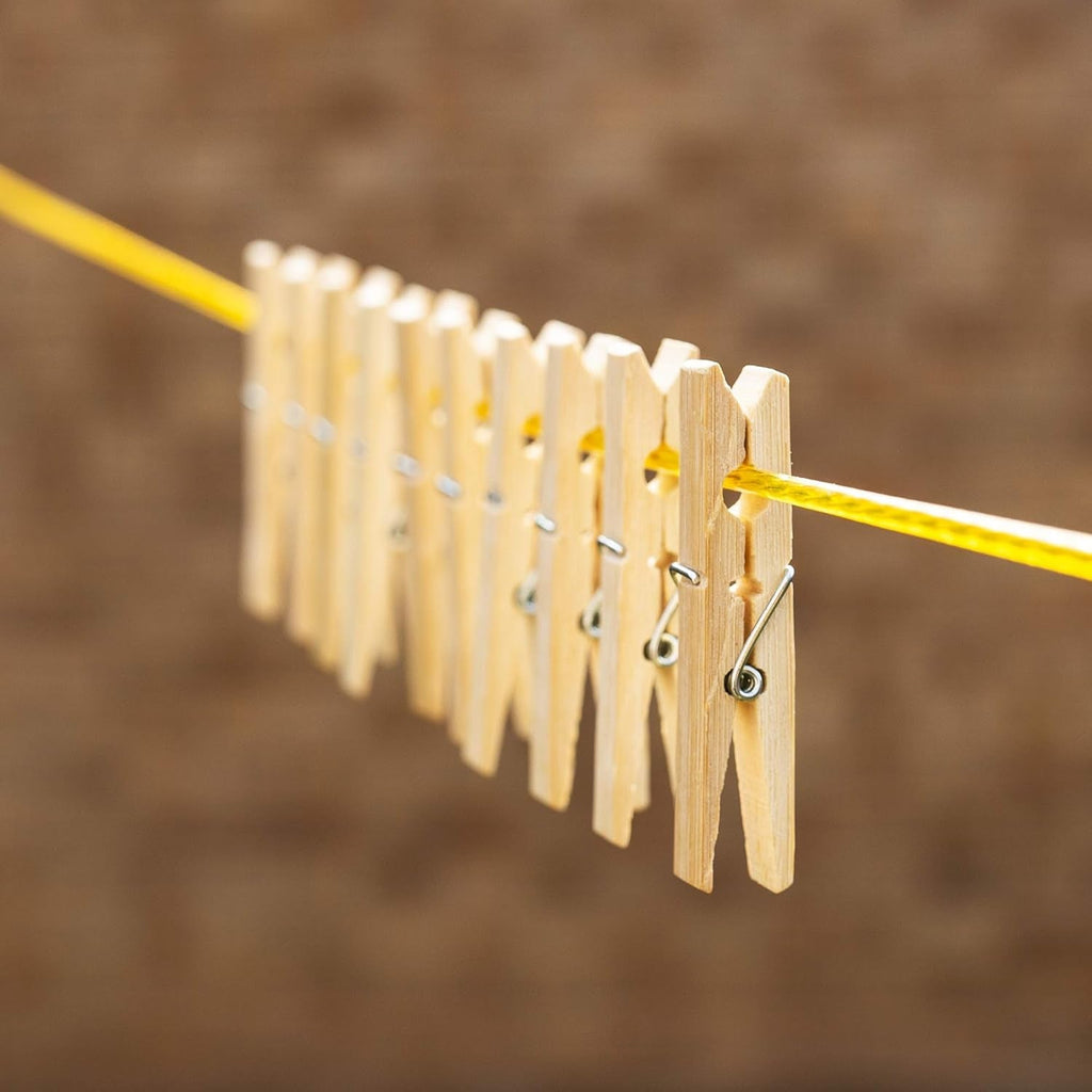 Eco-friendly bamboo cloth clips neatly displayed, highlighting their sustainable material.