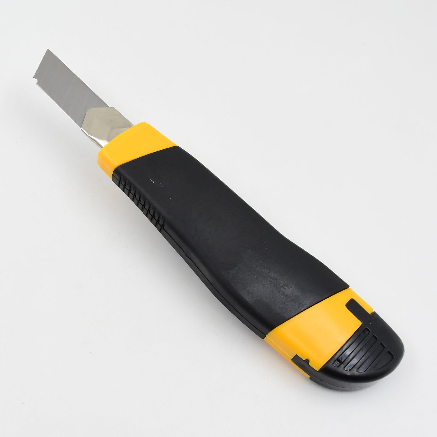 A heavy-duty cutter knife in action, slicing through cardboard with precision.